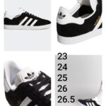 Tenis casual de gamuza, color negro con franjas blancas y suela blanca. Talla: 23, 24, 25, 26 y 26.5